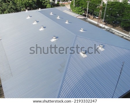 Beautiful gray metal sheet roof in commercial construction. Royalty-Free Stock Photo #2193332247