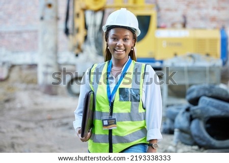 Happy engineer, construction worker or architect woman feeling proud and satisfied with career opportunity. Portrait of black building management employee or manager working on a project site Royalty-Free Stock Photo #2193338333