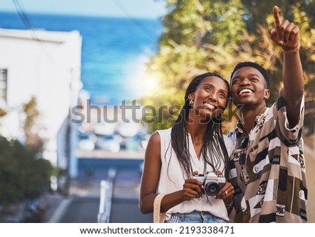 Photographer couple on summer vacation or holiday abroad and tourism with lens flare, ocean and street background. Black people, man and woman looking at tourist destination for travel photography