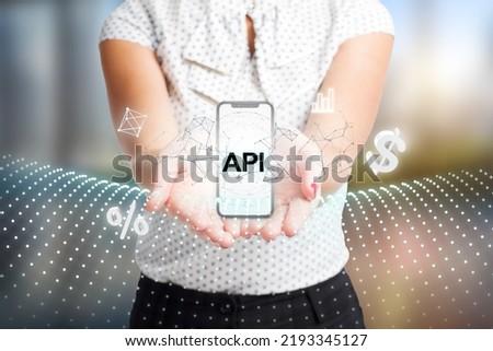 Business, Technology, Internet and network concept. Young businessman working on a virtual screen of the future and sees the inscription: API