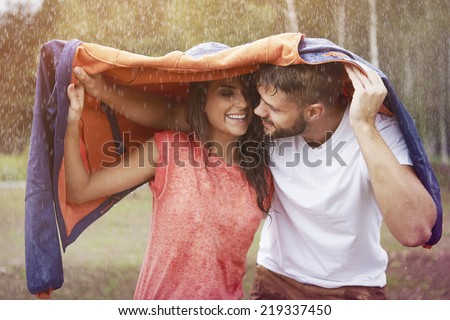 Romantic time in the rain  Royalty-Free Stock Photo #219337450