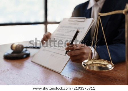 Lawyer working or reading agreement contract in office workplace for consultant. lawyer concept