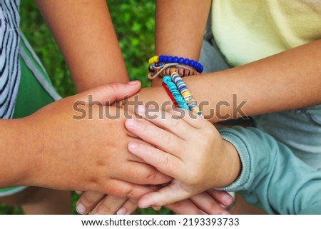 The children put their hands together. Selective focus. kids