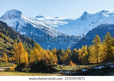 Scenic view at snow capped mountains in autumn Royalty-Free Stock Photo #2193393871