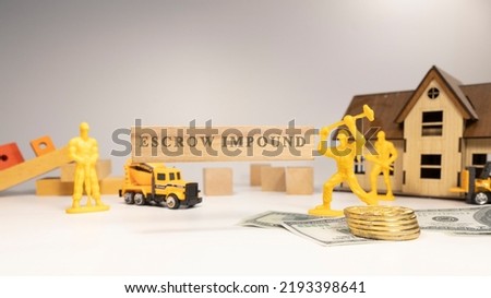 Escrow impound was written on the wooden surface. economy and business Royalty-Free Stock Photo #2193398641