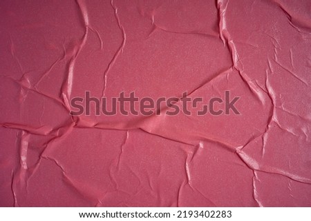 Pink background. Wet and wrinkled sheet of paper. Background mockup.