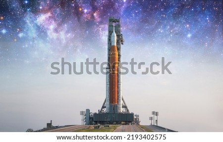 Spaceship on launch pad. Mission to Moon. Return to Moon. SLS space rocket. Orion spacecraft. Aretmis spae program to research solar system. Elements of this image furnished by NASA Royalty-Free Stock Photo #2193402575