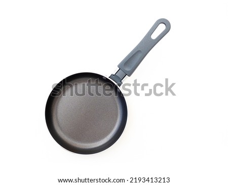 Iron blank pan or frying pan isolated on white, top view Royalty-Free Stock Photo #2193413213