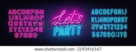 Let s Party neon sign on brick wall background. Royalty-Free Stock Photo #2193416167