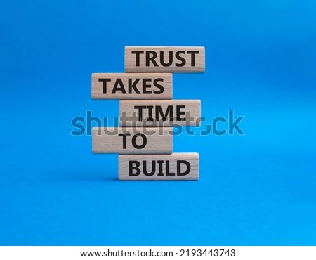 Tell us what you think symbol. Wooden blocks with words Tell us what you think. Beautiful blue background. Business and Tell us what you think concept. Copy space.