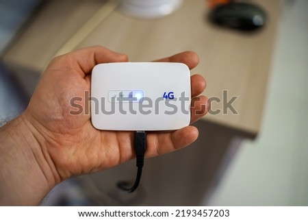 Modern wireless pocket 4g wifi modem. Royalty-Free Stock Photo #2193457203