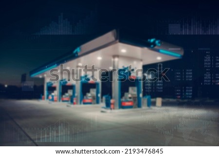Gas station with fuel dispensers on technological background. Graph of rising prices for gasoline and fuel. Rising fuel prices and the global crisis