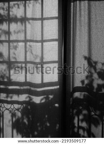 Afternoon sunlight generates creamy shadow on curtains. August, 2022 in Seoul, South Korea.