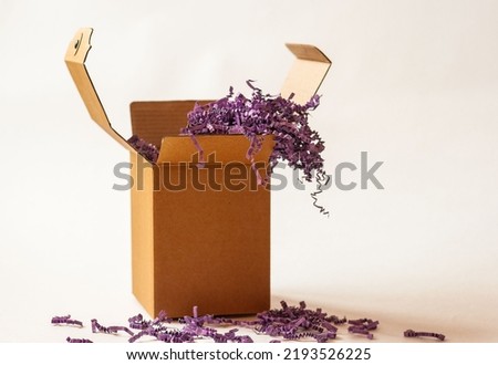 brown cardboard box on a light background for gift wrapping for the holiday