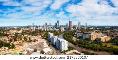 Short aerial cityscape skyline panorama of Parramatta CBD on river in Western Sydney. Royalty-Free Stock Photo #2193530107