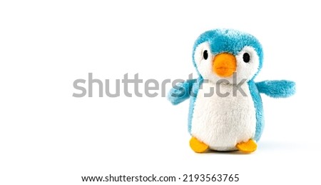 plush penguin on a white background