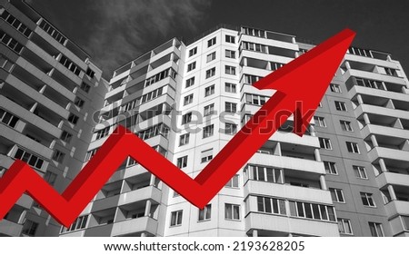 Red growing up large arrow on residential building monochrome background. Rising prices for purchase, sale and rental of real estate. Flat. Bar chart and graph. Interest Rate Increases. Apartment. Royalty-Free Stock Photo #2193628205