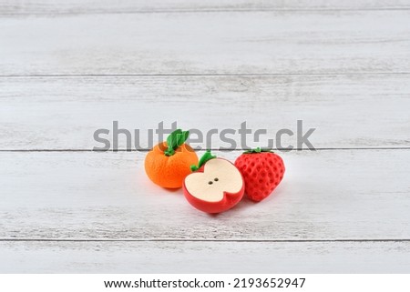 Photo of mandarin oranges, strawberries and apples