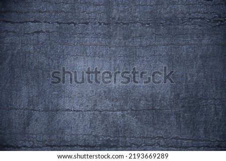 Concrete wall structure with  stripes pattern. Abstract architecture. Modern architectural detail. Traces of furrows or fissures. Geometric background with uneven parallel lines. Royalty-Free Stock Photo #2193669289