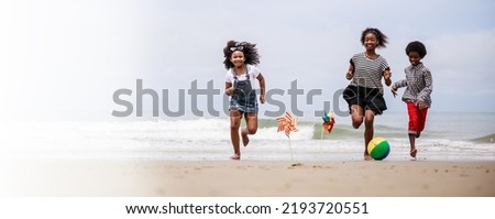 Banner size. Group of Happy African American children running on a tropical beach