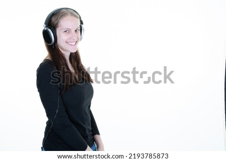 portrait of pretty woman in headphones enjoying music in copyspace isolated on white background