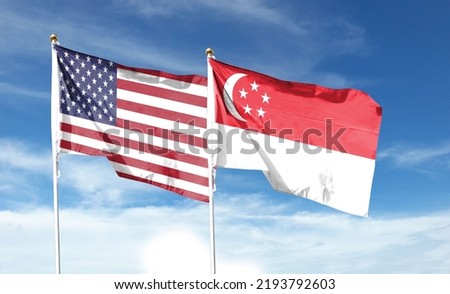 American flag and Singapore flag on cloudy sky. waving in the sky