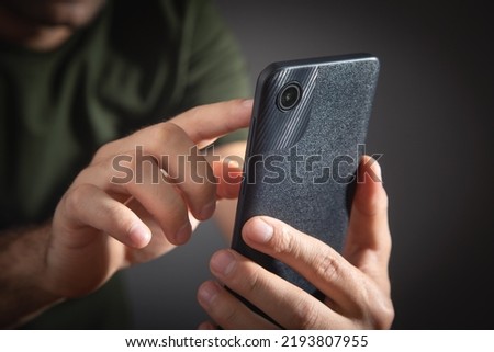 Man taking picture with a smartphone.
