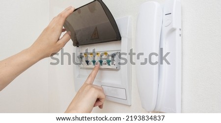 Electrical switchboard with automatic current switches. The concept of security in the apartment against a short circuit. Close-up Royalty-Free Stock Photo #2193834837