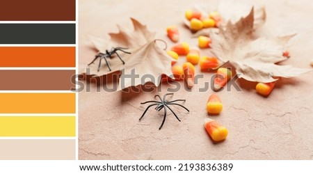 Halloween corn candies and autumn leaves on beige background. Different color patterns