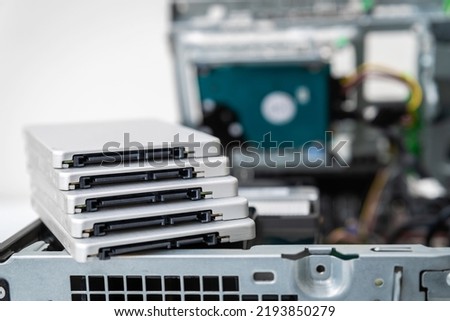 Closed-up view of SSD hard disk drives on top of business desktop PC. Focus on connection interface Royalty-Free Stock Photo #2193850279