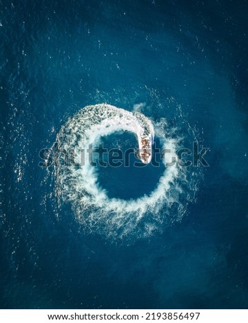 aerial wallpaper of boat making a circle