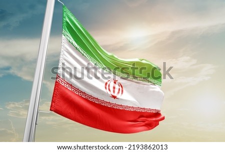 Iran national flag waving in beautiful clouds.