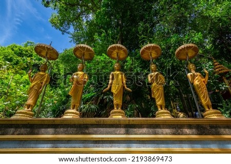 The gold five Buddha statue at Wat Cha Am Khiri, Phetchaburi, Thailand