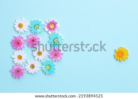 Pattern of wooden colored flowers on blue background