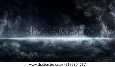Smoke And Fog On Asphalt In Black Defocused Background - Halloween Backdrop Royalty-Free Stock Photo #2193904287