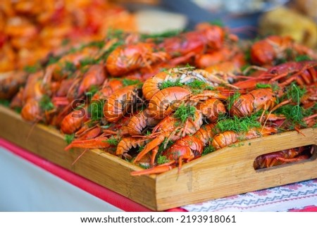Boiled red crayfish or crawfish with herbs. Crayfish boiling in the pot on the fire.