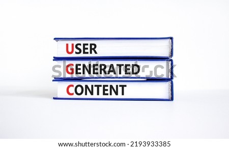UGC user generated content symbol. Concept words UGC user generated content on books on a beautiful white table white background. Business and UGC user generated content concept. Copy space. Royalty-Free Stock Photo #2193933385