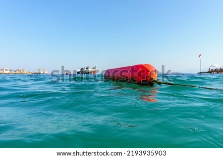 Buoy on the beach of the Aegean Sea. Selective focus. There is a place for your text. The concept of active recreation and rescue on the water. Bodrum, Mugla province, Turkey, Europe.