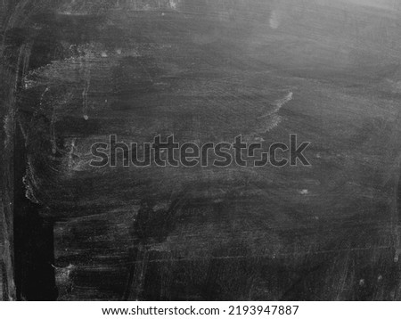 Black Blackboard Chalkboard texture.Empty blank dark dirty school board wall banner background backdrop with traces of chalk for text.School,Cafe,bakery,restaurant menu template wallpaper.Lettering. Royalty-Free Stock Photo #2193947887