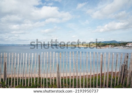 wooden fence front of the sea. Seascape of coastline of côte d'-azur