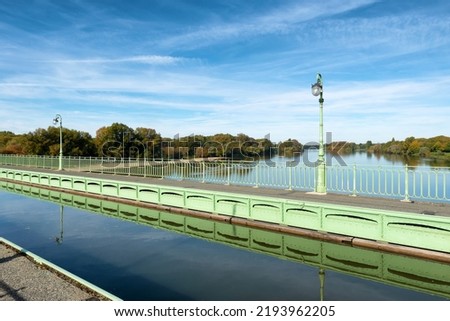 The Briare Aqueduct in central France carries a canal over the river Loire on its journey to the Seine. Royalty-Free Stock Photo #2193962205
