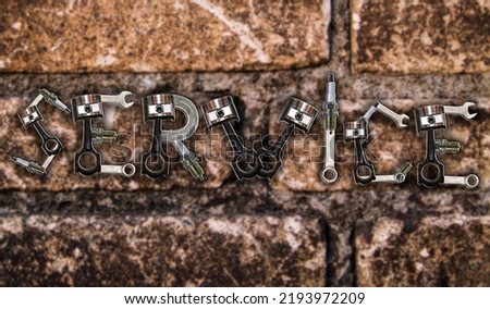 The word Service is made of car engine parts on a brick wall background