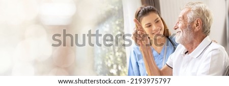 Web banner Man being cared for by a private Asian nurse at home suffering from Alzheimer's disease to closely care for elderly patients with copy space on left Royalty-Free Stock Photo #2193975797