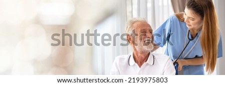 Web banner Man being cared for by a private Asian nurse at home suffering from Alzheimer's disease to closely care for elderly patients with copy space on left Royalty-Free Stock Photo #2193975803