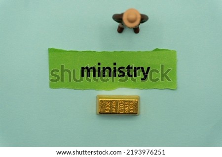 ministry.The word is written on a slip of paper,on colored background. professional terms of finance, business words, economic phrases. concept of economy.