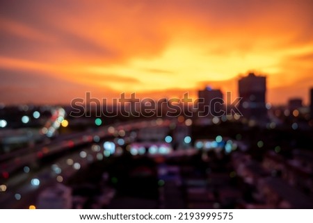 Blur photo background of Bangkok cityscape at twilight time, building skyscraper and creative office in the downtown district.