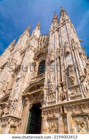 The Milan Cathedral (Italian: Duomo di Milano, Lombard: Domm de Milan, or Metropolitan Cathedral-Basilica of the Nativity of Saint Mary is a major cathedral in Milan. Royalty-Free Stock Photo #2194003413