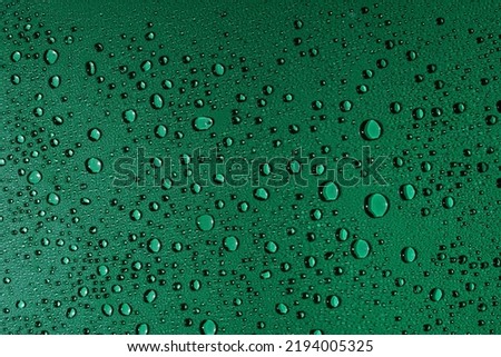 Water droplets on glass surface,
