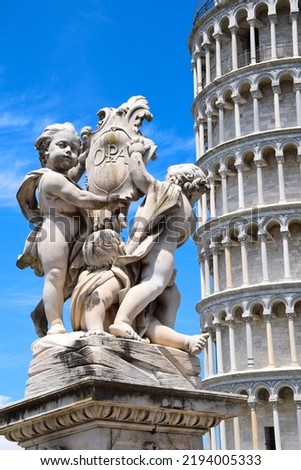 Leaning tower of Pisa with angels, Italy Royalty-Free Stock Photo #2194005333