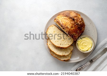 Soda bread, traditional fast, homemade irish bread with butter, top view Royalty-Free Stock Photo #2194040387